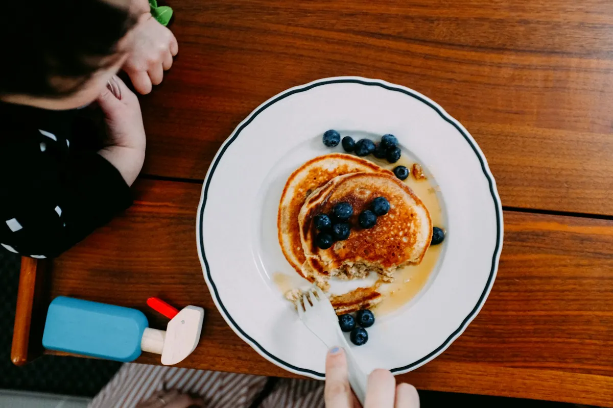 A plate of pancakes and berries photographed from above