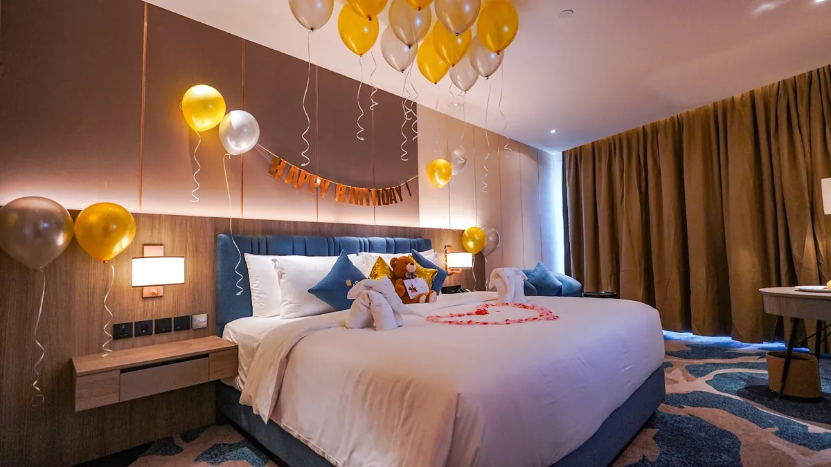 A decorated room with warm lighting prepared for a celebration