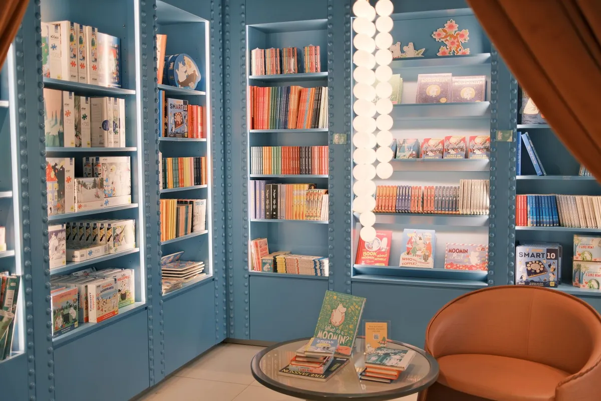 A library reading corner with bookshelves and a round chair