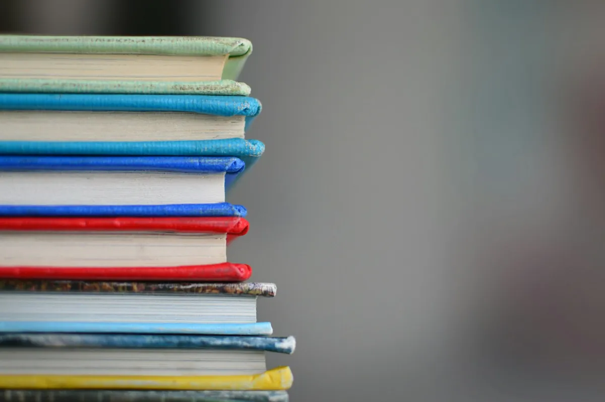 A neat stack of colourful hardback books