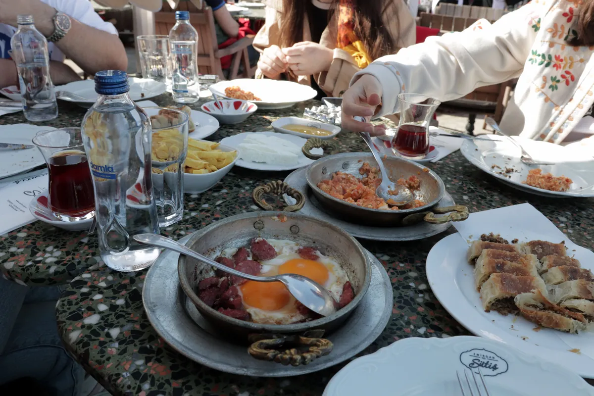 A table laid with breakfast plates and glasses