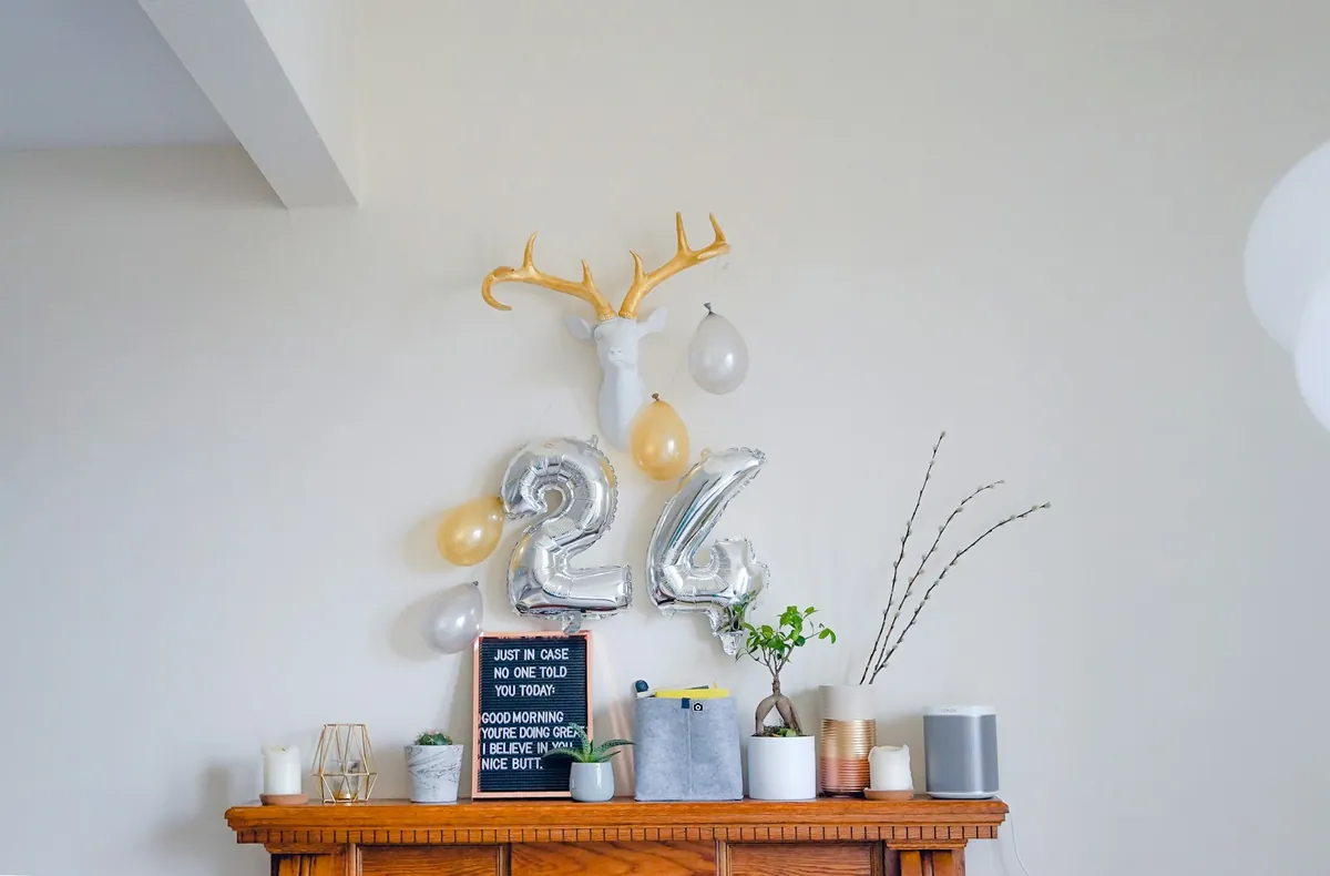 Birthday number balloons arranged on a shelf