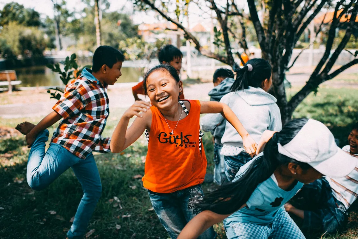Children running and playing together outdoors
