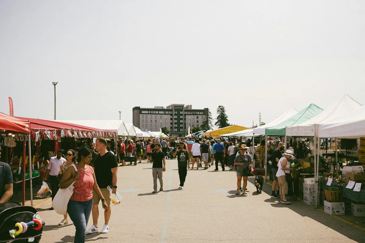 Rows of market tents stretching along a street