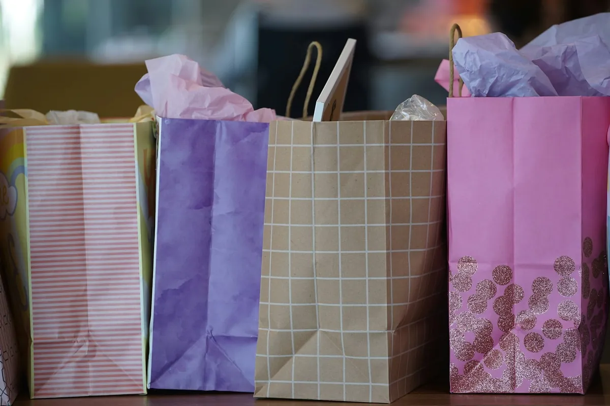 Pastel coloured party bags lined up on a table