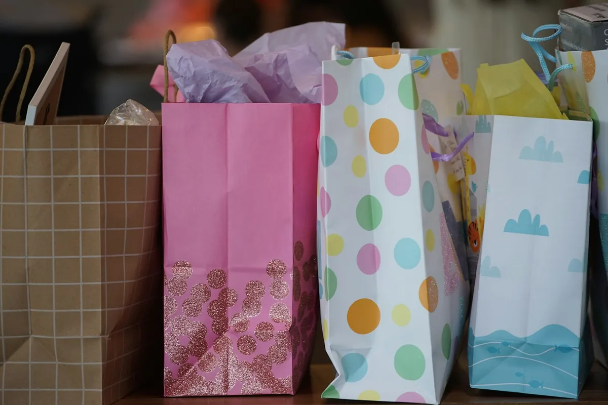 Patterned paper party bags standing on a table