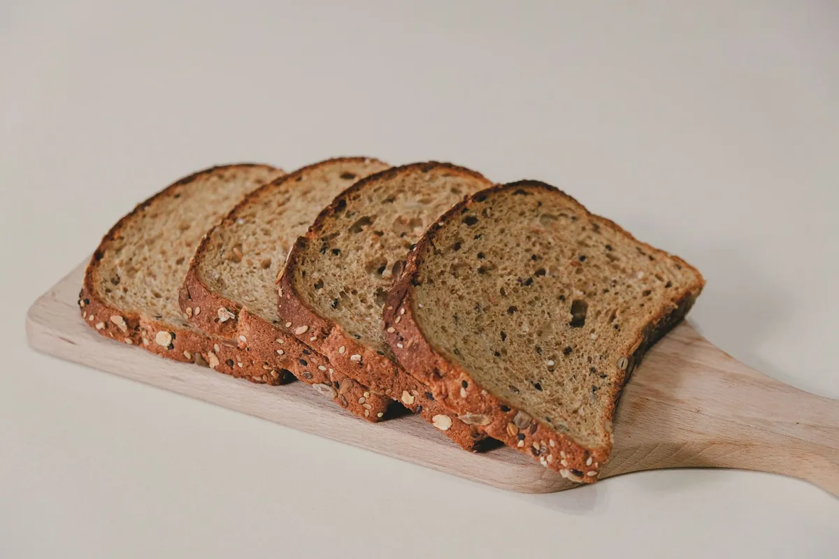 Slices of seeded bread arranged on a board
