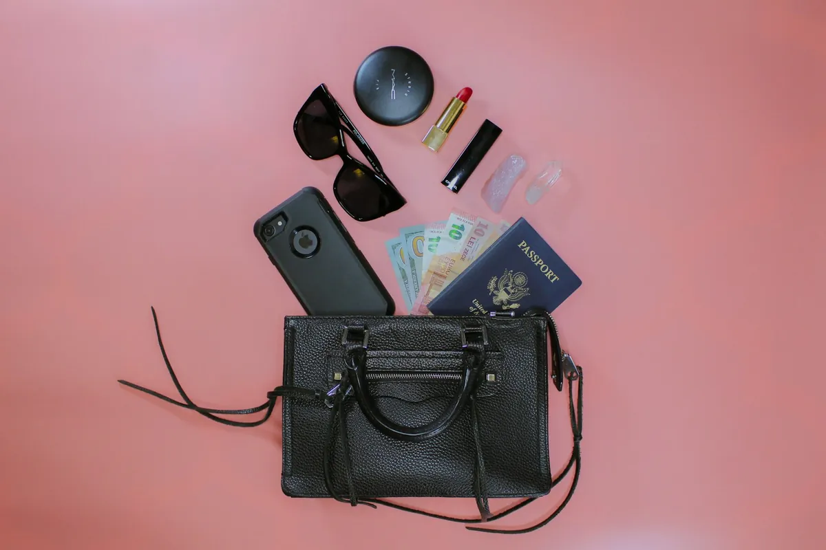 The contents of a shoulder bag laid out flat