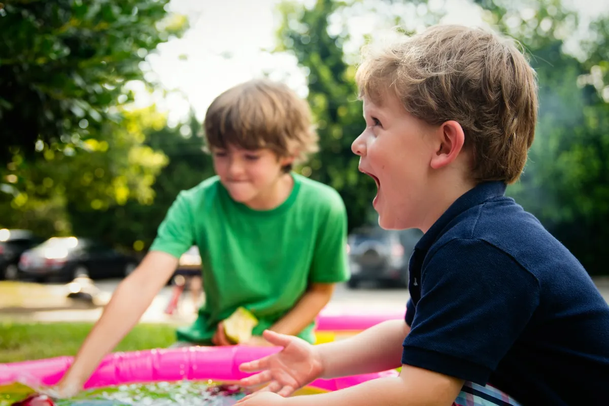 Two young children playing happily together